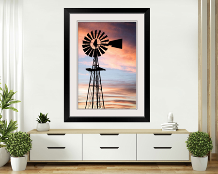 Farm windmill at sunset